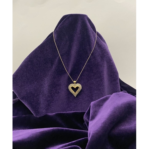 31 - A STUNNING 10CT YELLOW GOLD WHITE SAPPHIRE HEART PENDANT NECKLACE, the heart shaped pendant set with... 