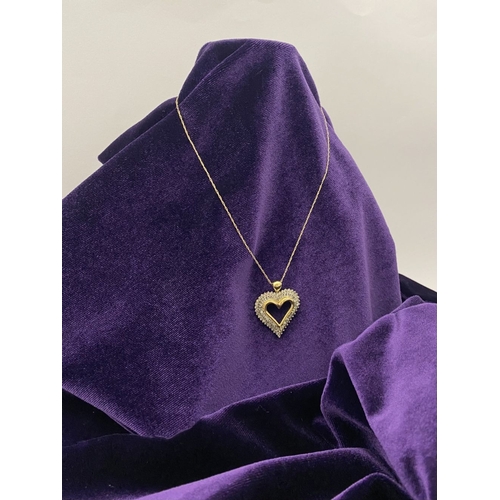 31 - A STUNNING 10CT YELLOW GOLD WHITE SAPPHIRE HEART PENDANT NECKLACE, the heart shaped pendant set with... 