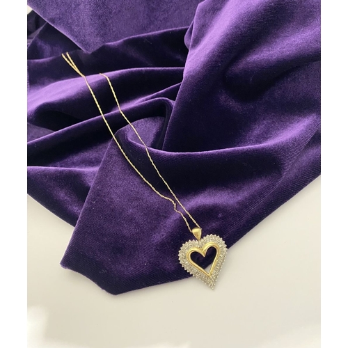 31 - A STUNNING 10CT YELLOW GOLD WHITE SAPPHIRE HEART PENDANT NECKLACE, the heart shaped pendant set with... 