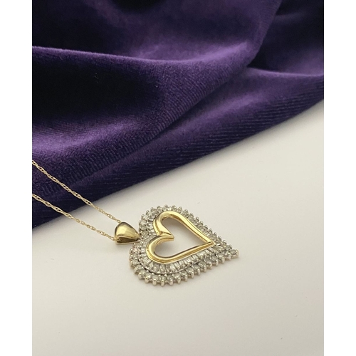 31 - A STUNNING 10CT YELLOW GOLD WHITE SAPPHIRE HEART PENDANT NECKLACE, the heart shaped pendant set with... 