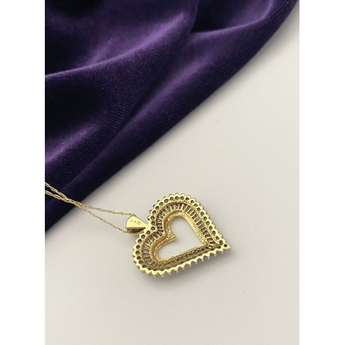 31 - A STUNNING 10CT YELLOW GOLD WHITE SAPPHIRE HEART PENDANT NECKLACE, the heart shaped pendant set with... 