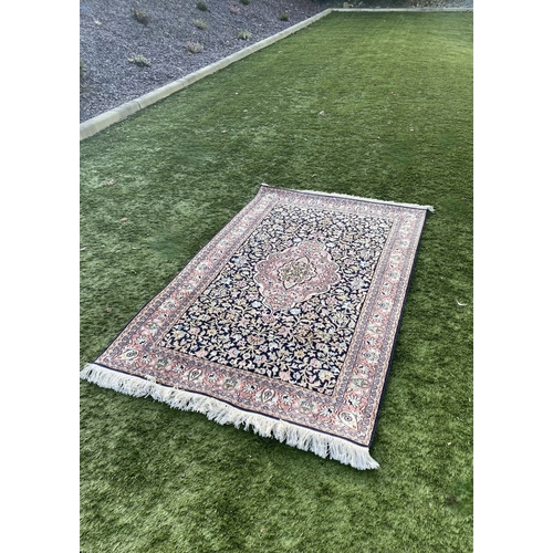 35 - A GOOD QUALITY PERSIAN KASHMIRI RUG, silk/cotton pile, featuring traditional floral medallion design... 
