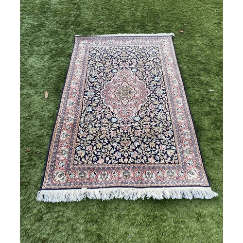 35 - A GOOD QUALITY PERSIAN KASHMIRI RUG, silk/cotton pile, featuring traditional floral medallion design... 