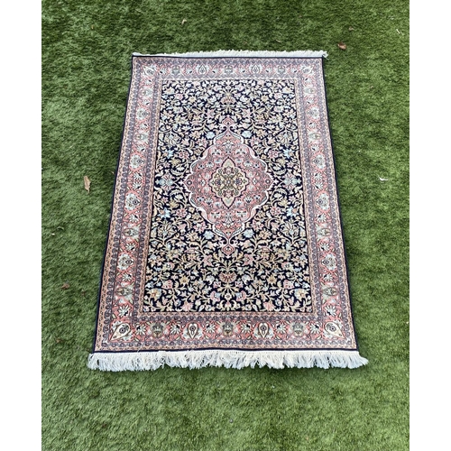 35 - A GOOD QUALITY PERSIAN KASHMIRI RUG, silk/cotton pile, featuring traditional floral medallion design... 