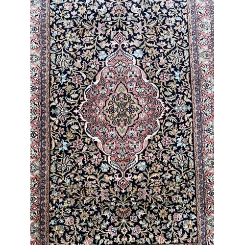 35 - A GOOD QUALITY PERSIAN KASHMIRI RUG, silk/cotton pile, featuring traditional floral medallion design... 
