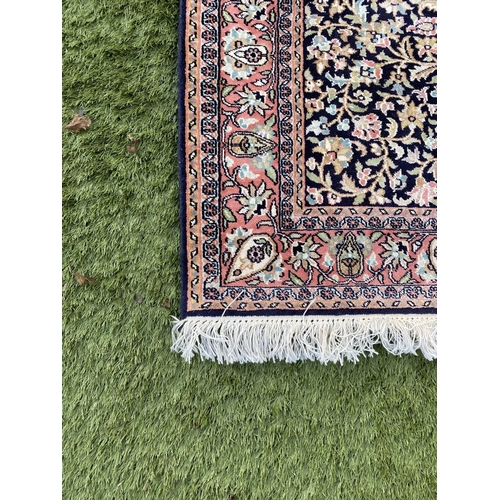 35 - A GOOD QUALITY PERSIAN KASHMIRI RUG, silk/cotton pile, featuring traditional floral medallion design... 