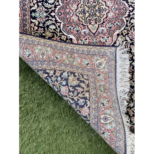 35 - A GOOD QUALITY PERSIAN KASHMIRI RUG, silk/cotton pile, featuring traditional floral medallion design... 