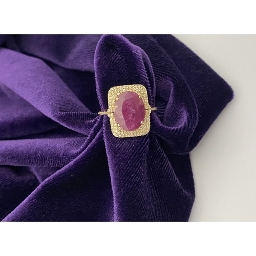 4 - A MAGNIFICENT 14CT GOLD RUBY & DIAMOND STATEMENT RING, with central 6.65ct oval mixed cut ruby, claw... 