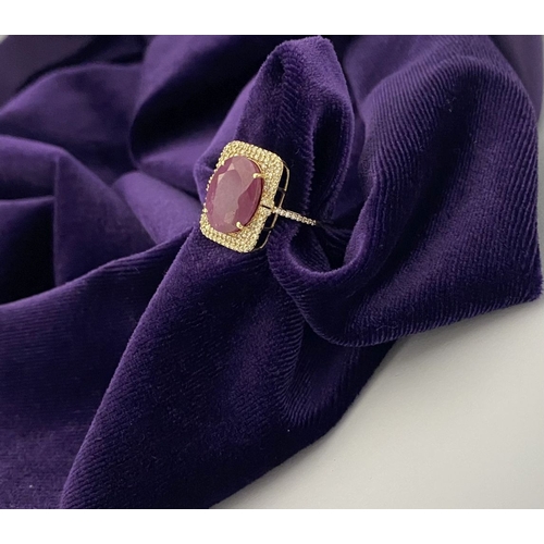 4 - A MAGNIFICENT 14CT GOLD RUBY & DIAMOND STATEMENT RING, with central 6.65ct oval mixed cut ruby, claw... 