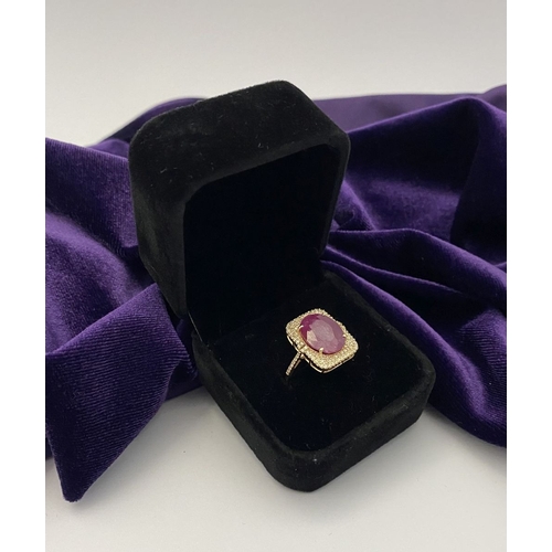 4 - A MAGNIFICENT 14CT GOLD RUBY & DIAMOND STATEMENT RING, with central 6.65ct oval mixed cut ruby, claw... 
