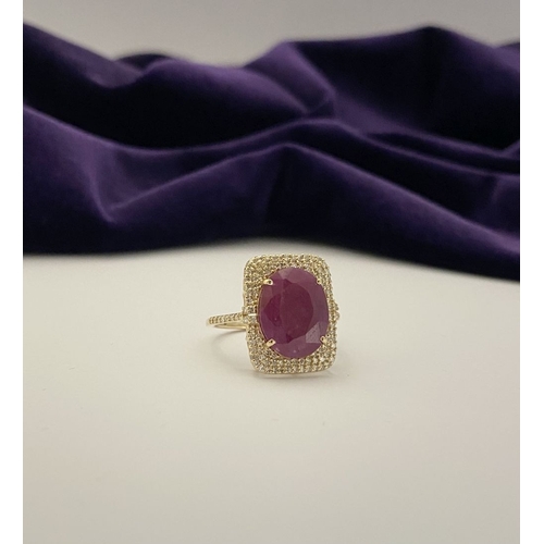 4 - A MAGNIFICENT 14CT GOLD RUBY & DIAMOND STATEMENT RING, with central 6.65ct oval mixed cut ruby, claw... 