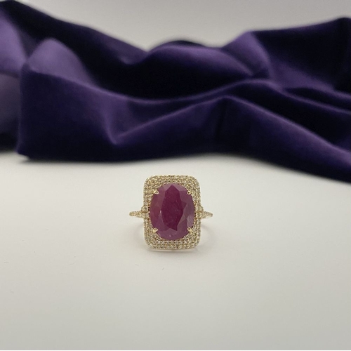 4 - A MAGNIFICENT 14CT GOLD RUBY & DIAMOND STATEMENT RING, with central 6.65ct oval mixed cut ruby, claw... 