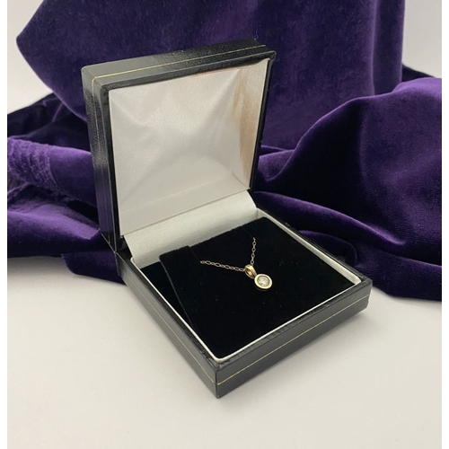 44 - AN ELEGANT 9CT YELLOW GOLD DIAMOND SOLITAIRE PENDANT NECKLACE, featuring beautiful round cut diamond... 