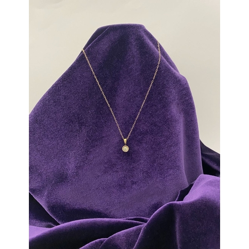 44 - AN ELEGANT 9CT YELLOW GOLD DIAMOND SOLITAIRE PENDANT NECKLACE, featuring beautiful round cut diamond... 