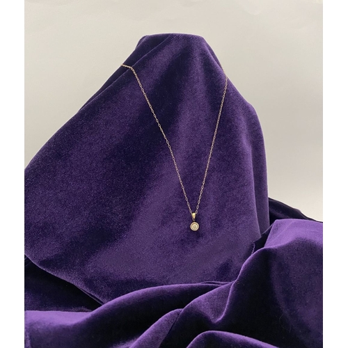 44 - AN ELEGANT 9CT YELLOW GOLD DIAMOND SOLITAIRE PENDANT NECKLACE, featuring beautiful round cut diamond... 