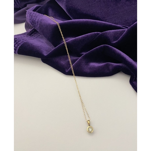 44 - AN ELEGANT 9CT YELLOW GOLD DIAMOND SOLITAIRE PENDANT NECKLACE, featuring beautiful round cut diamond... 