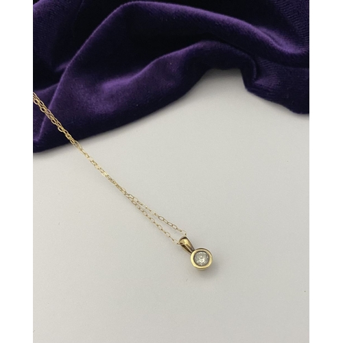 44 - AN ELEGANT 9CT YELLOW GOLD DIAMOND SOLITAIRE PENDANT NECKLACE, featuring beautiful round cut diamond... 