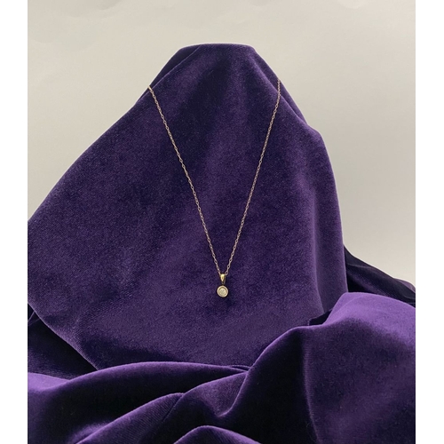 44 - AN ELEGANT 9CT YELLOW GOLD DIAMOND SOLITAIRE PENDANT NECKLACE, featuring beautiful round cut diamond... 