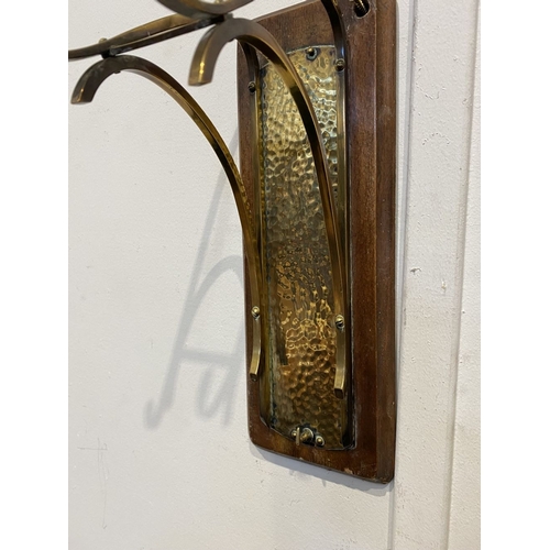 46 - A BRASS WALL HANGING DINNER GONG, wall mountable hardwood stand, with brass hanging hooks and hammer... 