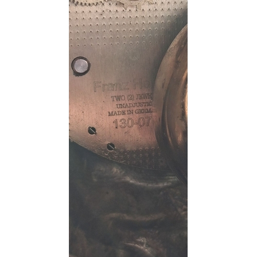 55 - A LOUIS XV STYLE BRASS FRANZ HERMLE MANTLE CLOCK, intricate piece with figural putti finial, raised ... 