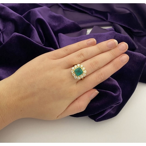 9 - AN EXCEPTIONAL 18CT GOLD EMERALD & DIAMOND CLUSTER RING, with central vibrant emerald in bezel setti... 