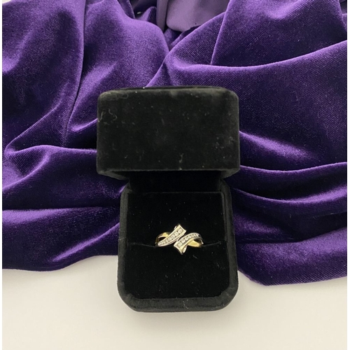 131 - A BEAUTIFUL TWO-TONE 14CT GOLD DIAMOND BYPASS RING, set with fourteen brilliant round cut diamonds, ... 