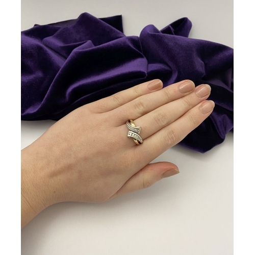 131 - A BEAUTIFUL TWO-TONE 14CT GOLD DIAMOND BYPASS RING, set with fourteen brilliant round cut diamonds, ... 