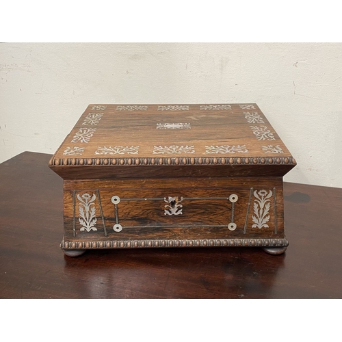 133 - AN ANTIQUE VICTORIAN ROSEWOOD MOTHER OF PEARL INLAID SEWING BOX, the sarcophagus shaped box is highl... 