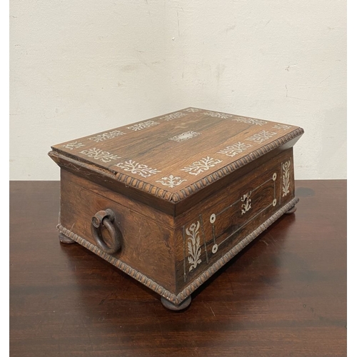 133 - AN ANTIQUE VICTORIAN ROSEWOOD MOTHER OF PEARL INLAID SEWING BOX, the sarcophagus shaped box is highl... 
