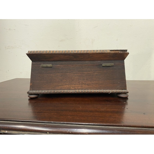 133 - AN ANTIQUE VICTORIAN ROSEWOOD MOTHER OF PEARL INLAID SEWING BOX, the sarcophagus shaped box is highl... 