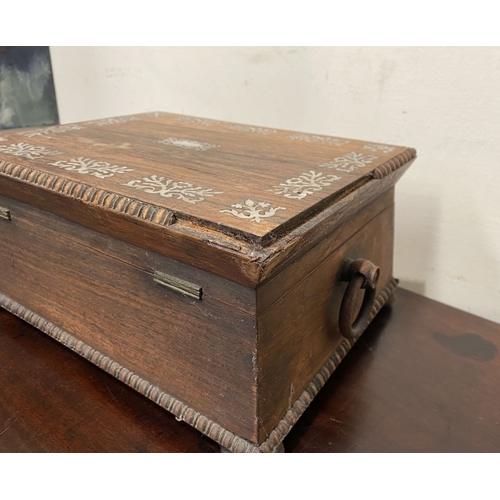 133 - AN ANTIQUE VICTORIAN ROSEWOOD MOTHER OF PEARL INLAID SEWING BOX, the sarcophagus shaped box is highl... 