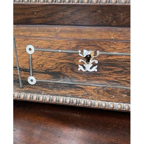 133 - AN ANTIQUE VICTORIAN ROSEWOOD MOTHER OF PEARL INLAID SEWING BOX, the sarcophagus shaped box is highl... 
