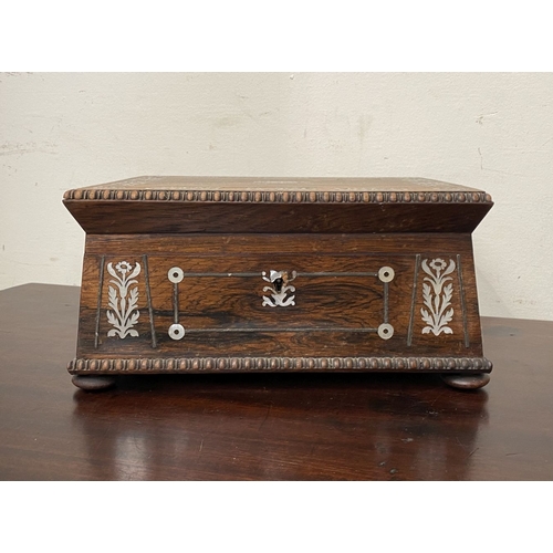 133 - AN ANTIQUE VICTORIAN ROSEWOOD MOTHER OF PEARL INLAID SEWING BOX, the sarcophagus shaped box is highl... 