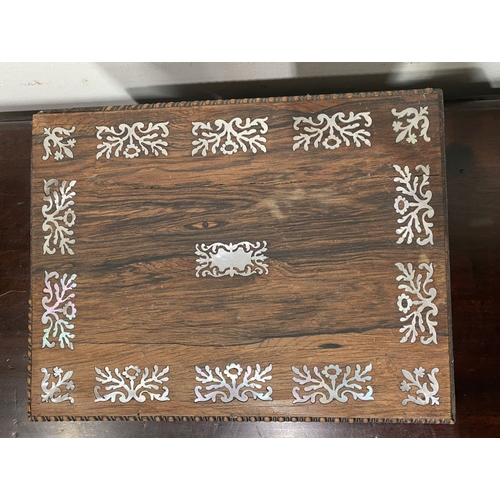133 - AN ANTIQUE VICTORIAN ROSEWOOD MOTHER OF PEARL INLAID SEWING BOX, the sarcophagus shaped box is highl... 