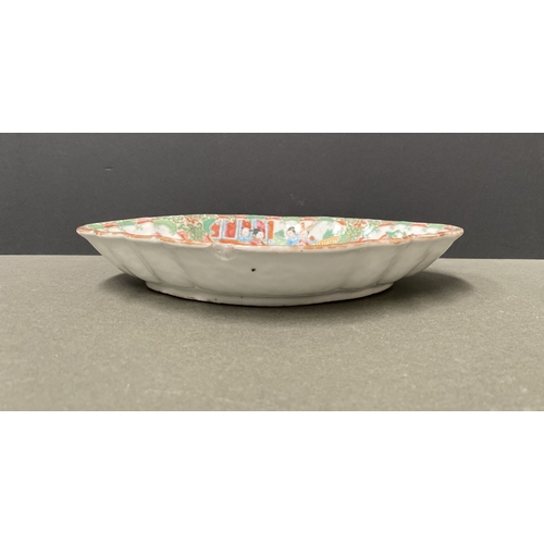 72 - A LATE 19TH CENTURY CHINESE CANTON FAMILLE ROSE SERVING PLATTER, c.1900, with scalloped rim on a low... 