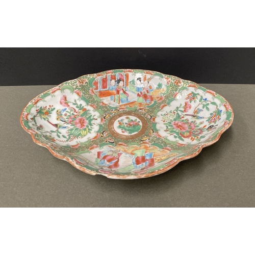 72 - A LATE 19TH CENTURY CHINESE CANTON FAMILLE ROSE SERVING PLATTER, c.1900, with scalloped rim on a low... 