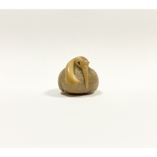 79 - AN ANTIQUE HAND CARVED JAPANESE TAGUA NUT NETSUKE, in the form of a crane, signed to base. Intricate... 
