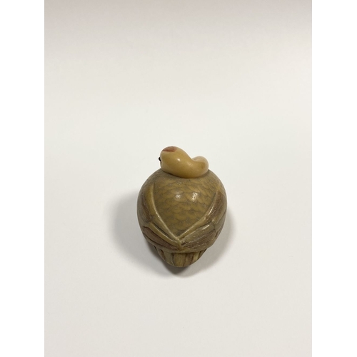 79 - AN ANTIQUE HAND CARVED JAPANESE TAGUA NUT NETSUKE, in the form of a crane, signed to base. Intricate... 
