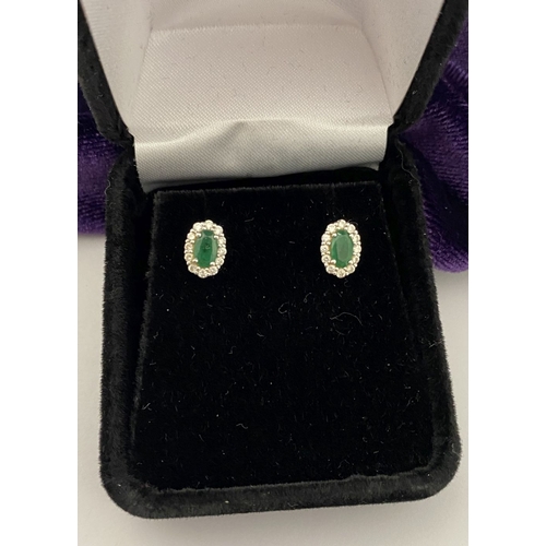 2 - A GORGEOUS PAIR OF 18CT WHITE GOLD EMERALD & DIAMOND CLUSTER STUD EARRINGS, each feature a central o... 