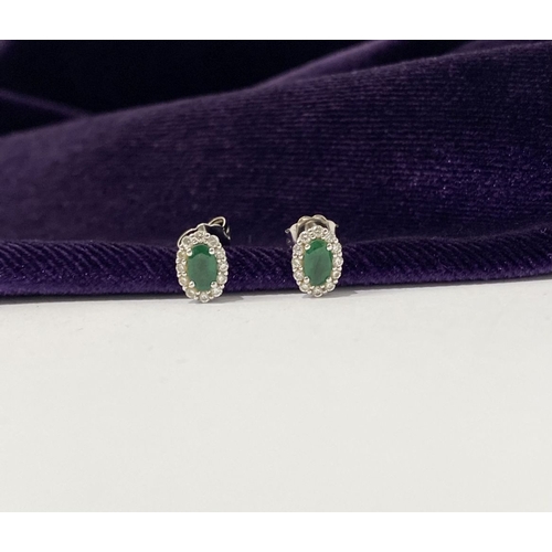 2 - A GORGEOUS PAIR OF 18CT WHITE GOLD EMERALD & DIAMOND CLUSTER STUD EARRINGS, each feature a central o... 