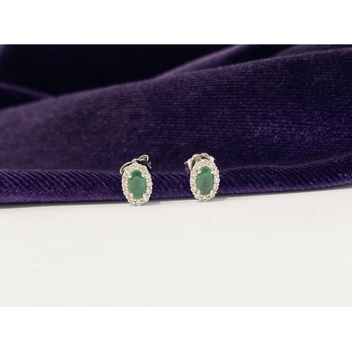 2 - A GORGEOUS PAIR OF 18CT WHITE GOLD EMERALD & DIAMOND CLUSTER STUD EARRINGS, each feature a central o... 