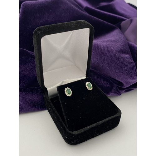 2 - A GORGEOUS PAIR OF 18CT WHITE GOLD EMERALD & DIAMOND CLUSTER STUD EARRINGS, each feature a central o... 