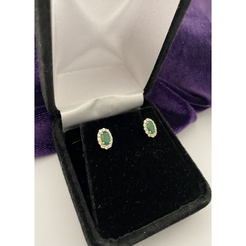 2 - A GORGEOUS PAIR OF 18CT WHITE GOLD EMERALD & DIAMOND CLUSTER STUD EARRINGS, each feature a central o... 