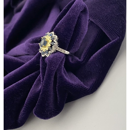 30 - A BEAUTIFUL 18CT GOLD PLATED NATURAL SAPPHIRE CLUSTER RING, featuring central oval cut sapphire, sur... 
