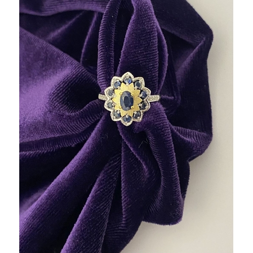 30 - A BEAUTIFUL 18CT GOLD PLATED NATURAL SAPPHIRE CLUSTER RING, featuring central oval cut sapphire, sur... 