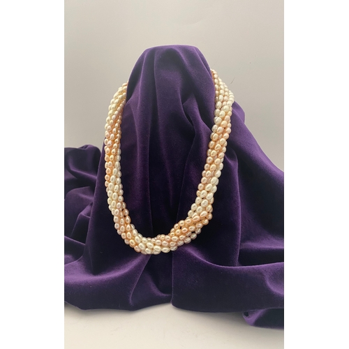 60 - A BEAUTIFUL SIX STRAND CULTURED PEARL NECKLACE, with silver clasp. Beautiful variety of tones to the... 