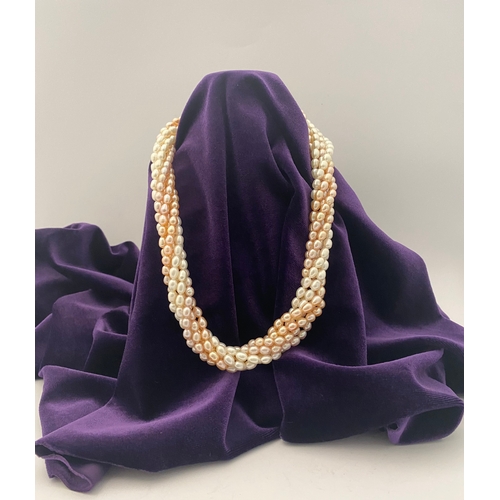60 - A BEAUTIFUL SIX STRAND CULTURED PEARL NECKLACE, with silver clasp. Beautiful variety of tones to the... 