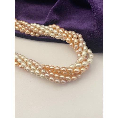 60 - A BEAUTIFUL SIX STRAND CULTURED PEARL NECKLACE, with silver clasp. Beautiful variety of tones to the... 