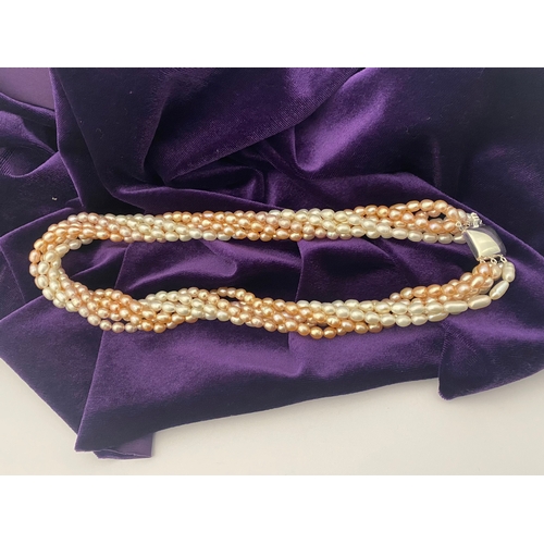 60 - A BEAUTIFUL SIX STRAND CULTURED PEARL NECKLACE, with silver clasp. Beautiful variety of tones to the... 