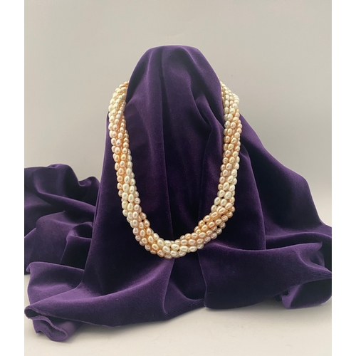 60 - A BEAUTIFUL SIX STRAND CULTURED PEARL NECKLACE, with silver clasp. Beautiful variety of tones to the... 